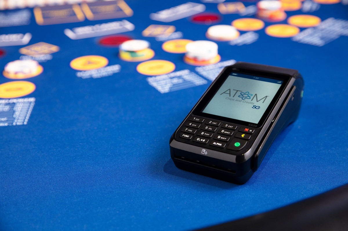 SCIENTIFIC GAMES INTRODUCES ATOM™ CASHLESS GAMING SOLUTION FOR TABLE GAMES AFTER ACQUIRING ACS’ PLAYON